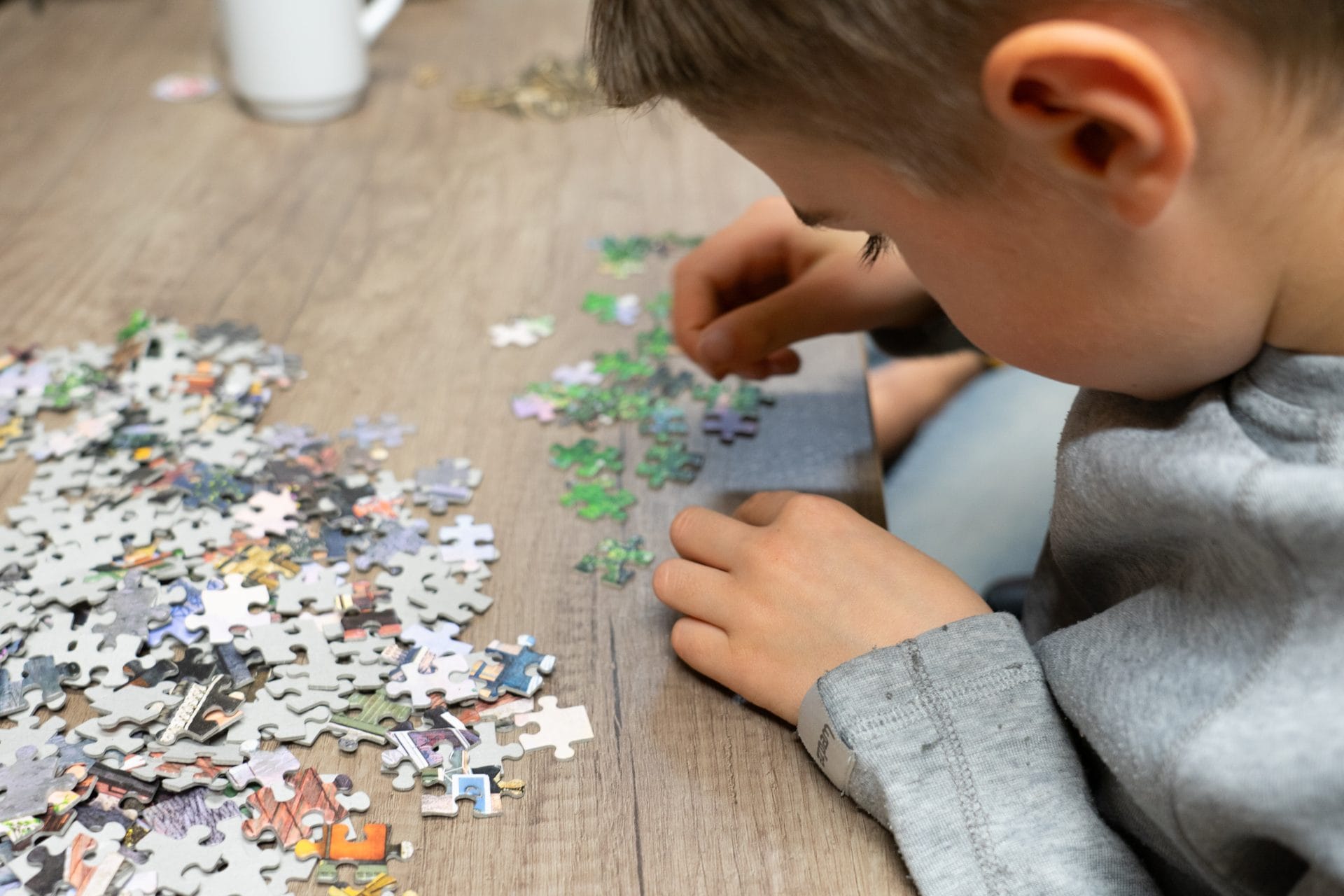 Family working together to solve an escape room puzzle